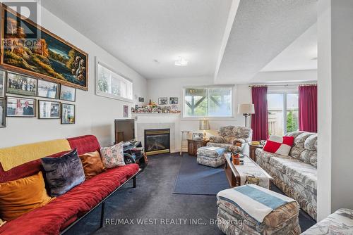 24 Todd Drive, Barrie (Innis-Shore), ON - Indoor Photo Showing Living Room With Fireplace