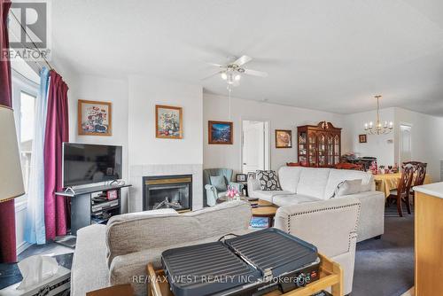 24 Todd Drive, Barrie (Innis-Shore), ON - Indoor Photo Showing Living Room With Fireplace