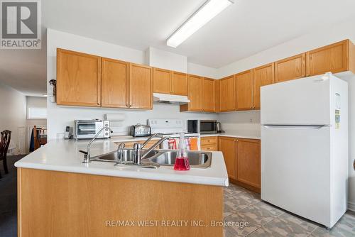 24 Todd Drive, Barrie (Innis-Shore), ON - Indoor Photo Showing Kitchen With Double Sink