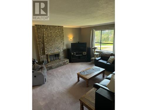 362 Thompson Road, Quesnel, BC - Indoor Photo Showing Living Room With Fireplace