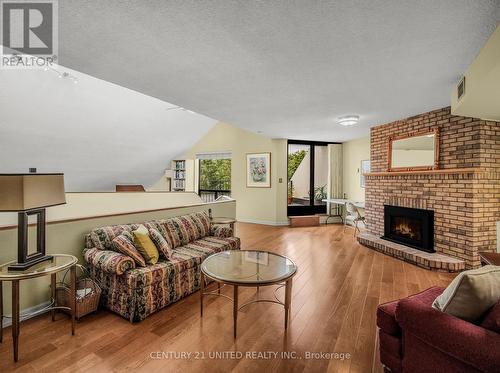 502 - 1818 Cherryhill Road, Peterborough (Monaghan), ON - Indoor Photo Showing Living Room With Fireplace