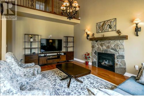 8897 Joseph Court, Niagara Falls, ON - Indoor Photo Showing Living Room With Fireplace