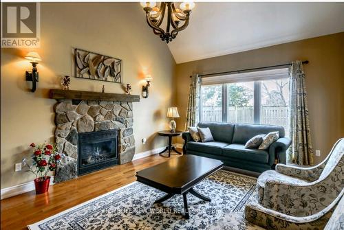 8897 Joseph Court, Niagara Falls, ON - Indoor Photo Showing Living Room With Fireplace