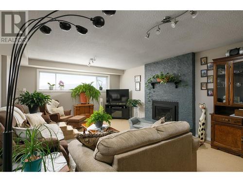 1149 Trevor Drive, West Kelowna, BC - Indoor Photo Showing Living Room With Fireplace