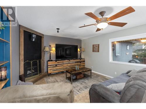 145 Magic Drive, Kelowna, BC - Indoor Photo Showing Living Room With Fireplace