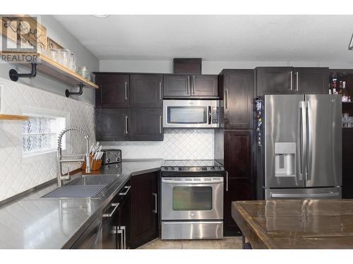 145 Magic Drive, Kelowna, BC - Indoor Photo Showing Kitchen With Upgraded Kitchen