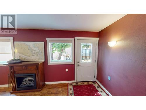 1908 Kokanee  N Place, Cranbrook, BC - Indoor Photo Showing Other Room With Fireplace