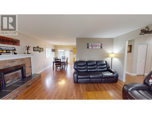 2481 Sing Street, Quesnel, BC - Indoor Photo Showing Living Room With Fireplace