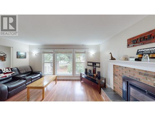 2481 Sing Street, Quesnel, BC - Indoor Photo Showing Living Room With Fireplace