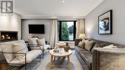 9 Delrosa Court, Toronto (Mount Olive-Silverstone-Jamestown), ON - Indoor Photo Showing Living Room With Fireplace