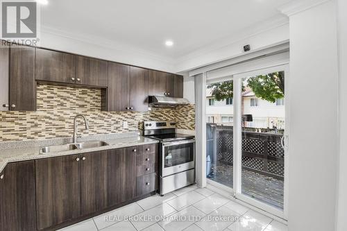 58 - 7475 Goreway Drive, Mississauga, ON - Indoor Photo Showing Kitchen With Double Sink