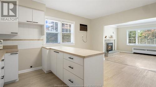 1640 Grand Marais Road East, Windsor, ON - Indoor Photo Showing Kitchen With Fireplace