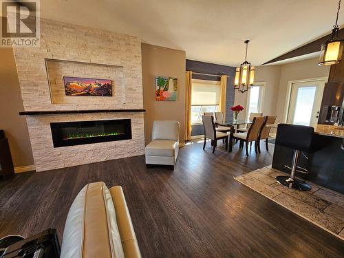 8409 18 Street, Dawson Creek, BC - Indoor Photo Showing Living Room With Fireplace