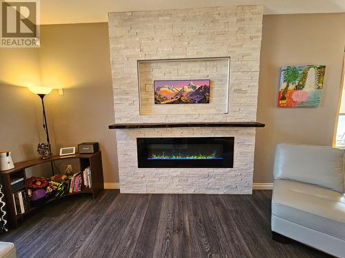 8409 18 Street, Dawson Creek, BC - Indoor Photo Showing Living Room With Fireplace