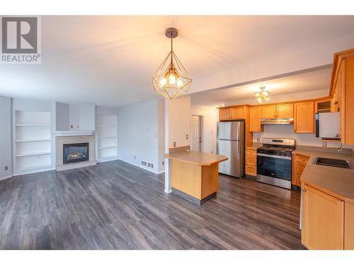 3462 South Main Street Unit# 10, Penticton, BC - Indoor Photo Showing Kitchen With Fireplace