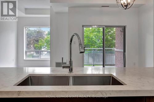 105 - 5070 Fairview Street, Burlington (Appleby), ON - Indoor Photo Showing Kitchen With Double Sink