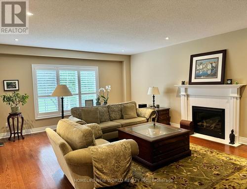 54 Roberson Drive, Ajax (Central West), ON - Indoor Photo Showing Living Room With Fireplace