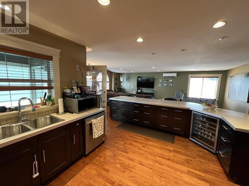 4439 Heritage Crescent, Fort Nelson, BC - Indoor Photo Showing Kitchen With Double Sink