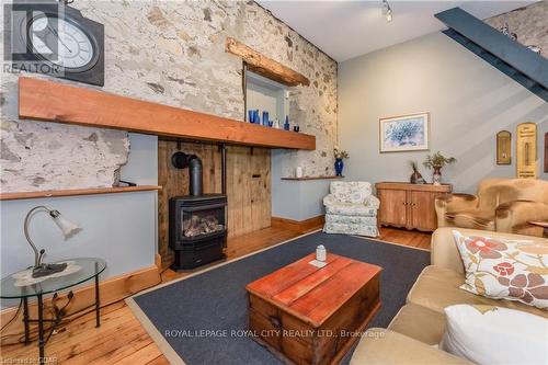 6086 5Th Line, Centre Wellington, ON - Indoor Photo Showing Living Room With Fireplace