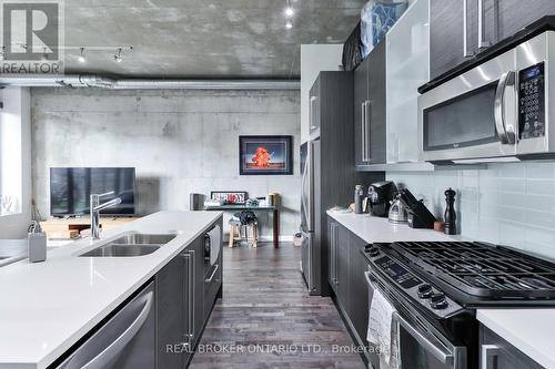 707 - 138 Princess Street, Toronto (Moss Park), ON - Indoor Photo Showing Kitchen With Stainless Steel Kitchen With Double Sink With Upgraded Kitchen