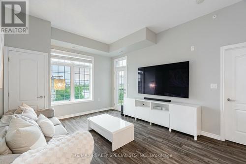 403 - 1460 Main Street E, Milton (Dempsey), ON - Indoor Photo Showing Living Room