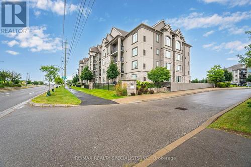 403 - 1460 Main Street E, Milton (Dempsey), ON - Outdoor With Facade