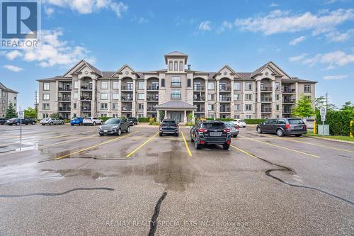 403 - 1460 Main Street E, Milton (Dempsey), ON - Outdoor With Balcony With Facade