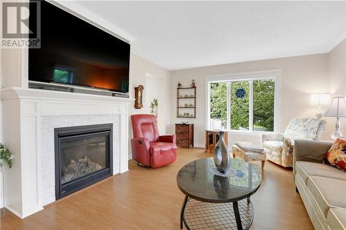 93 Barnet Boulevard, Renfrew, ON - Indoor Photo Showing Living Room With Fireplace