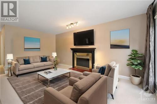 This photo has been virtually staged. - 839 Adencliffe Drive, Ottawa, ON - Indoor Photo Showing Living Room With Fireplace