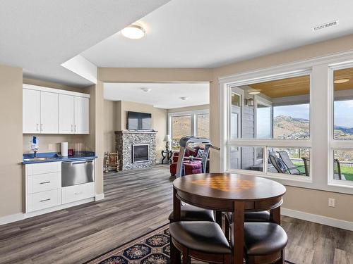 996 Quails Roost Crt, Kamloops, BC - Indoor Photo Showing Dining Room With Fireplace