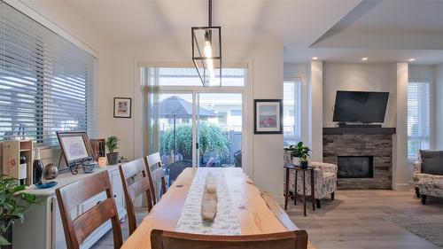 47-1960 Klo Road, Kelowna, BC - Indoor Photo Showing Dining Room With Fireplace