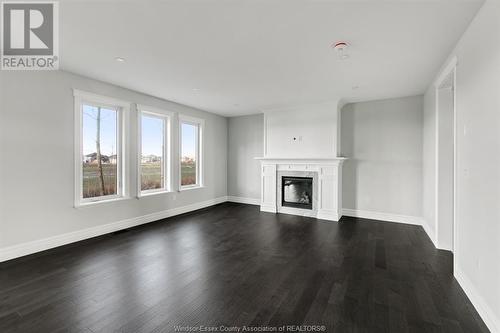 3450 Oke, Lasalle, ON - Indoor Photo Showing Living Room With Fireplace