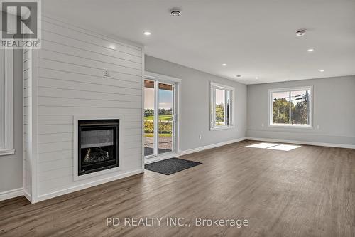 8 Acrevale Road, Kawartha Lakes, ON - Indoor Photo Showing Living Room With Fireplace