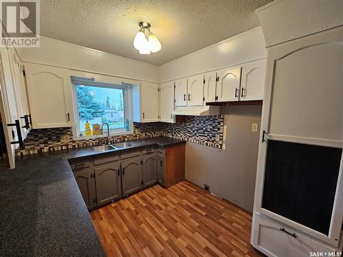 100 Alexander Street, Wawota, SK - Indoor Photo Showing Kitchen With Double Sink