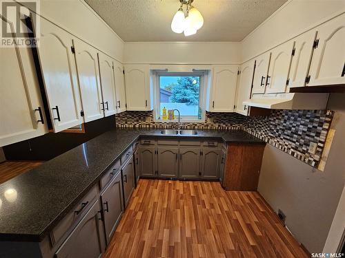 100 Alexander Street, Wawota, SK - Indoor Photo Showing Kitchen With Double Sink