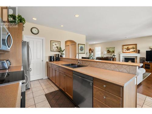 700 South Crest Drive Unit# 5 Lot# 5, Kelowna, BC - Indoor Photo Showing Kitchen With Fireplace With Double Sink