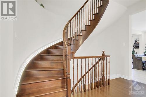 Beautiful spiral wood stair - 915 Guinness Crescent, Ottawa, ON - Indoor Photo Showing Other Room