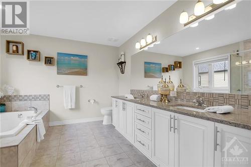 Huge primary ensuite with granite counters - 915 Guinness Crescent, Ottawa, ON - Indoor Photo Showing Bathroom