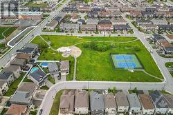 Park is 1 minute walk away with tennis courts, play structures and open field - 