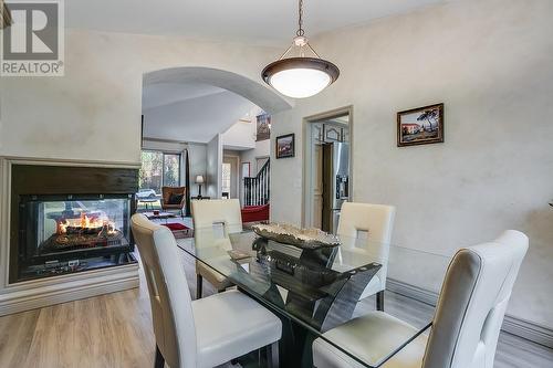 944 Purcell Court, Kelowna, BC - Indoor Photo Showing Dining Room With Fireplace