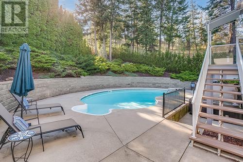 944 Purcell Court, Kelowna, BC - Outdoor With In Ground Pool With Deck Patio Veranda