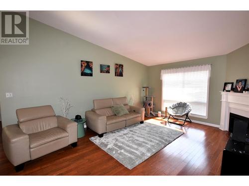 404 Hummingbird Avenue, Vernon, BC - Indoor Photo Showing Living Room With Fireplace