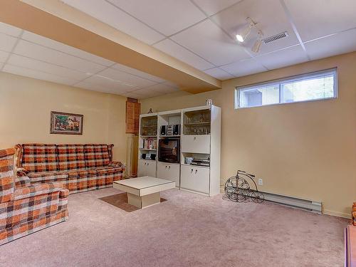 Salle familiale - 560 Rue Duquesne, Saint-Bruno-De-Montarville, QC - Indoor Photo Showing Basement