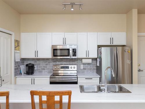 204-1959 Polo Park Crt, Central Saanich, BC - Indoor Photo Showing Kitchen With Double Sink With Upgraded Kitchen