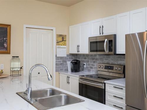 204-1959 Polo Park Crt, Central Saanich, BC - Indoor Photo Showing Kitchen With Double Sink