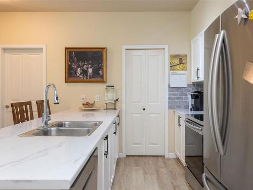 204-1959 Polo Park Crt, Central Saanich, BC - Indoor Photo Showing Kitchen With Double Sink