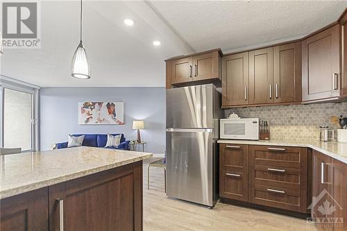 Kitchen upgraded with granite counters & stainless steel appliances. - 900 Dynes Road Unit#2206, Ottawa, ON - Indoor Photo Showing Kitchen With Upgraded Kitchen