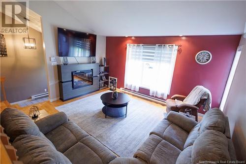 91 Dominique, Grand-Sault/Grand Falls, NB - Indoor Photo Showing Living Room With Fireplace