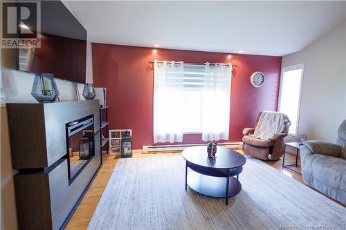 91 Dominique, Grand-Sault/Grand Falls, NB - Indoor Photo Showing Living Room With Fireplace