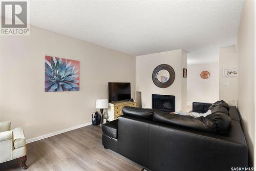 7306 Dalgliesh Drive, Regina, SK - Indoor Photo Showing Living Room With Fireplace